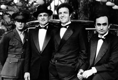 Al Pacino (Michael), Marlon Brando (Don Vito), James Caan (Santino), John Cazale (Fredo)